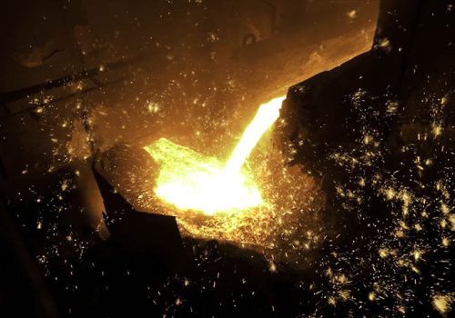 Pouring of liquid metal in open hearth workshop of the metallurgical plant. Smelting of the metal in the foundry at steel mill.